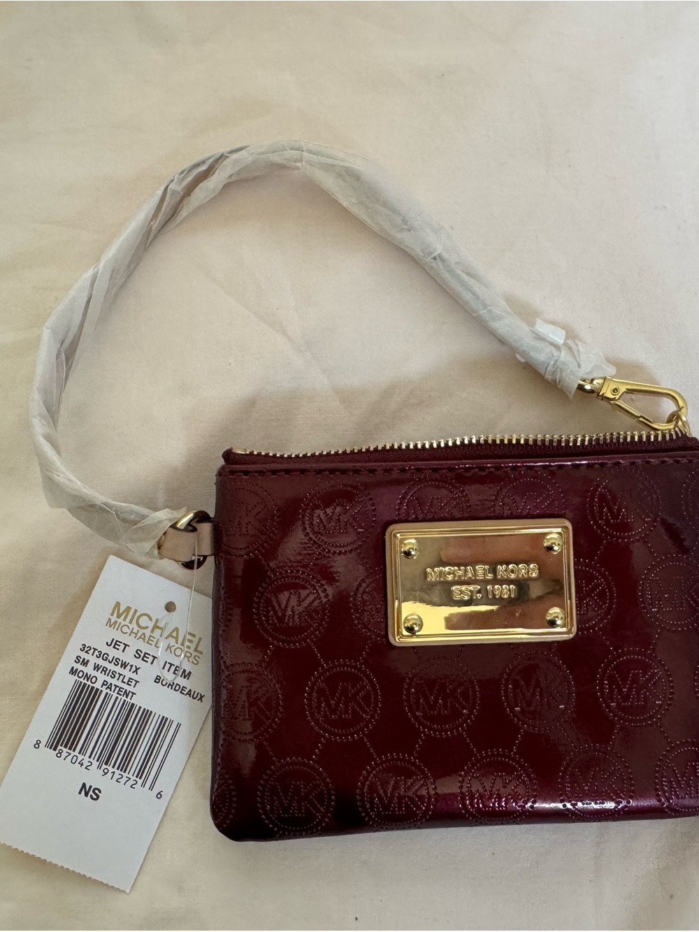 NWT Michael Kors Jet Set Small Wristlet - Patent Bordeaux Monogram (Flaw)